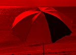 Red-filtered beach umbrella